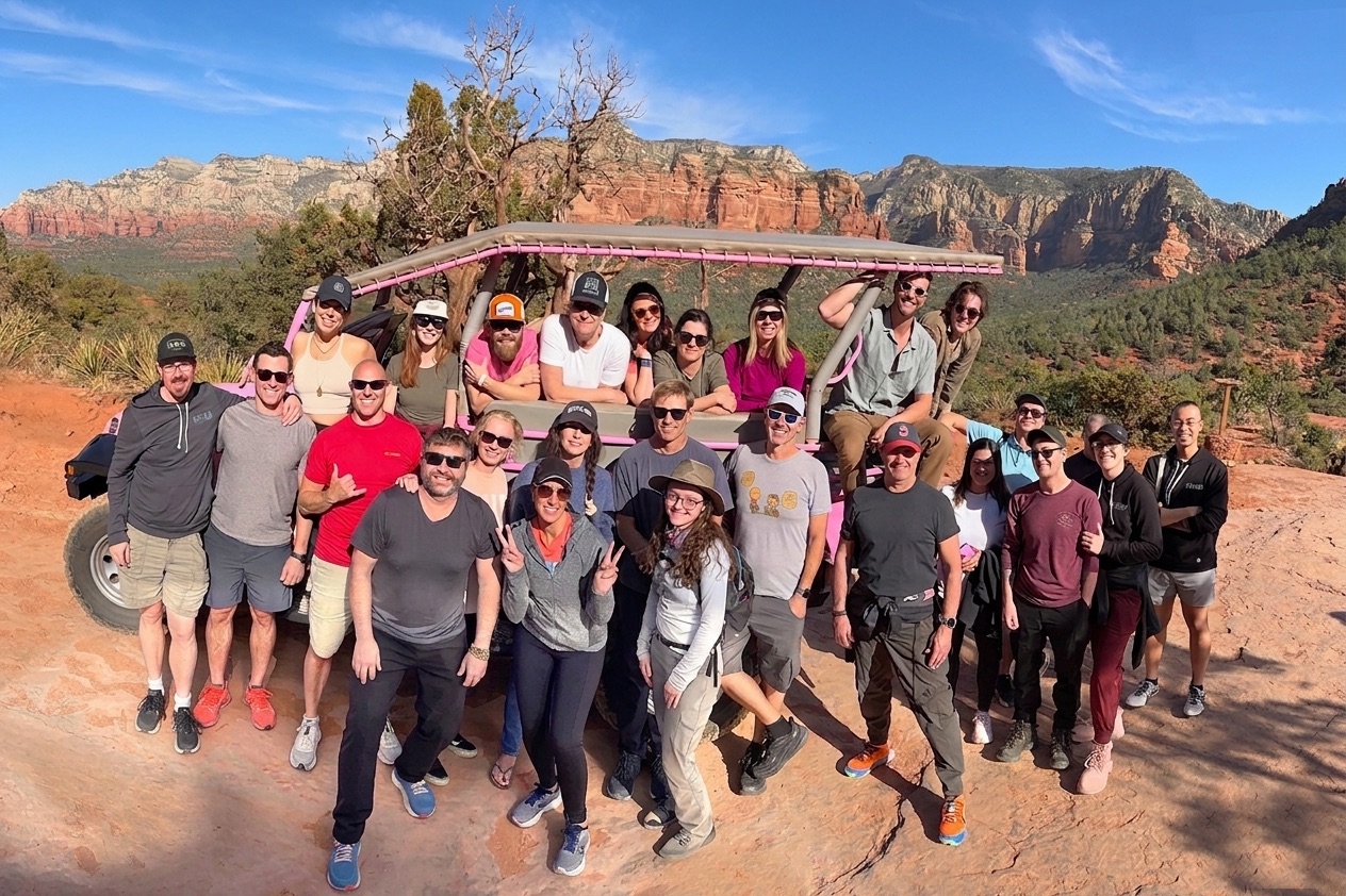 Qualia team on a pink Jeep tour through the red rocks of Sedona