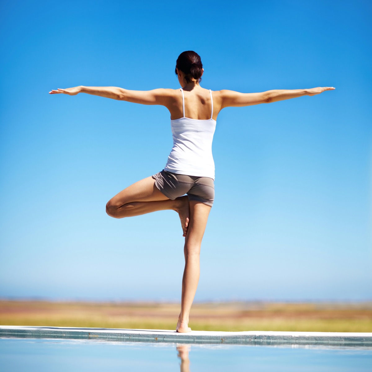 Practicing yoga outdoors